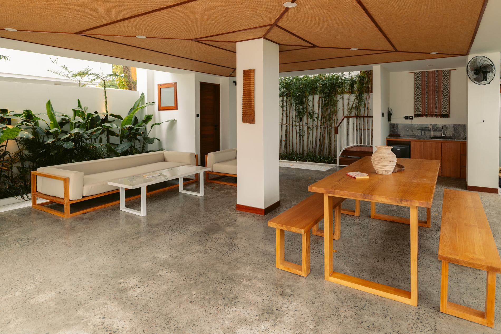 An open living area with a long timber table