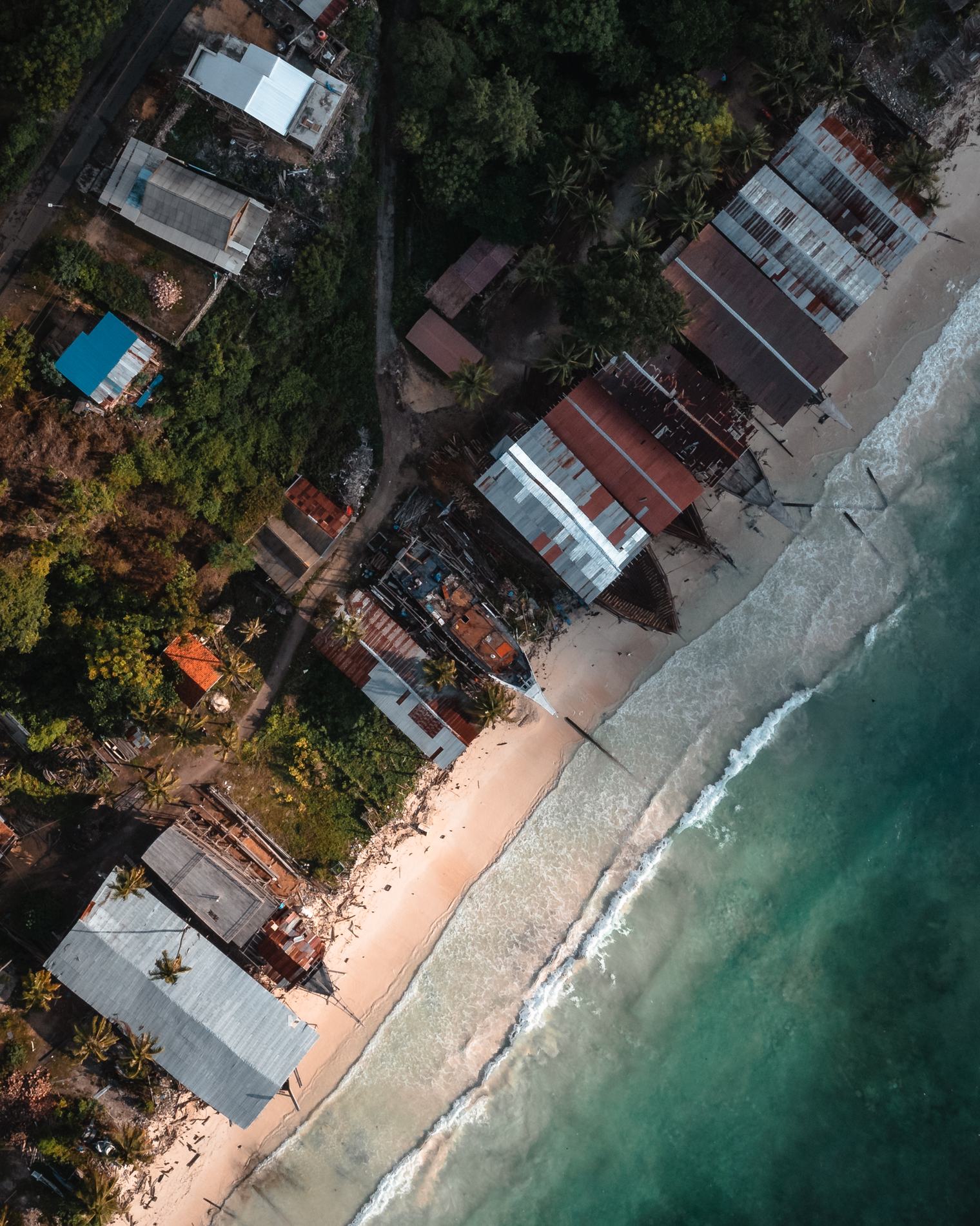 The beach shipyard from directly above, surf at the edge