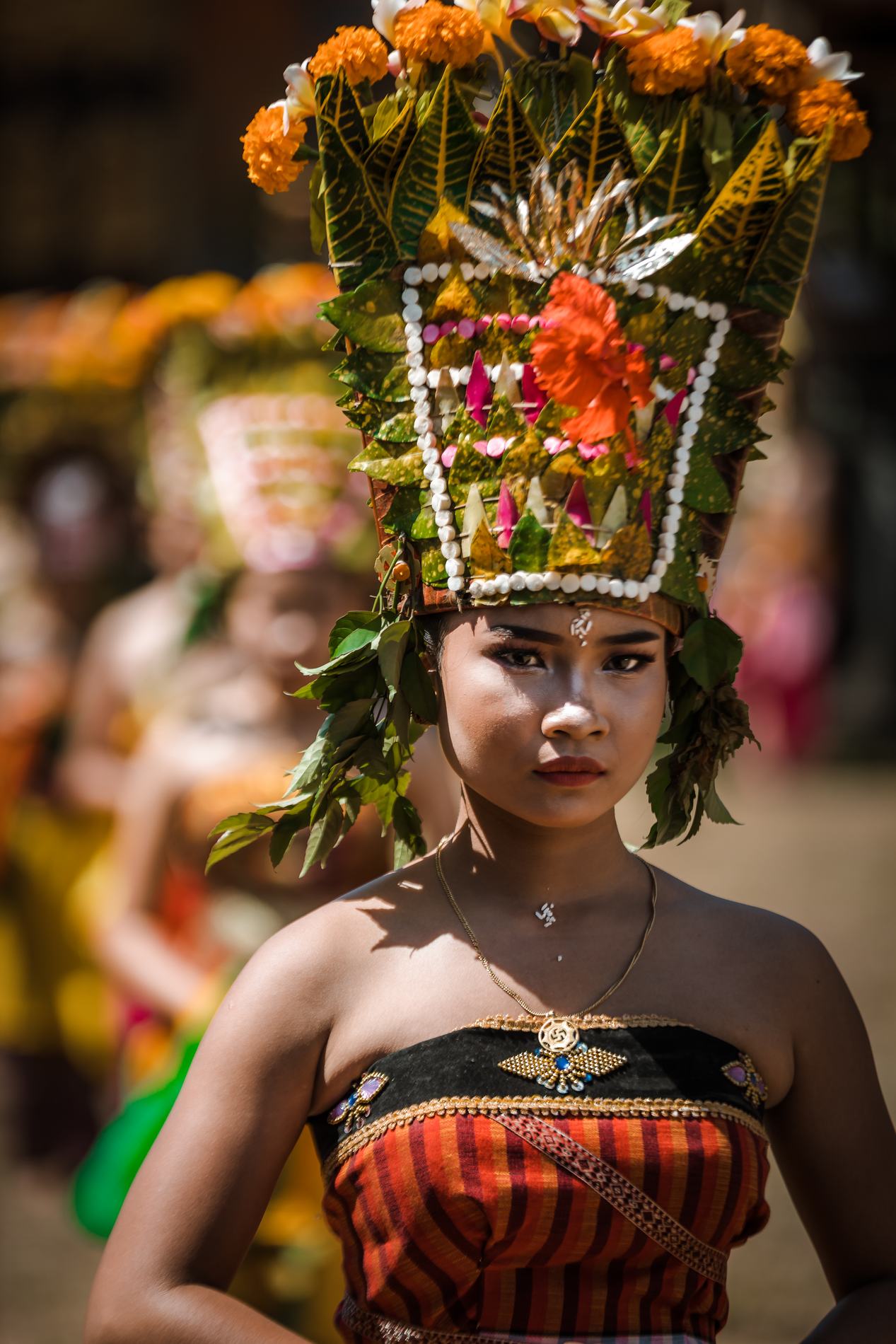 A young woman in a flower headdress at a ceremony