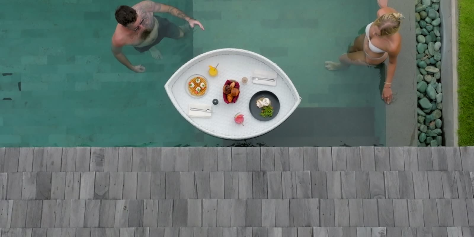 A couple at Hidden Hills Villas: a floating breakfast in the pool
